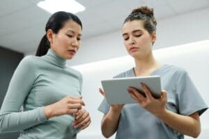 Two nurses looking at an iPad