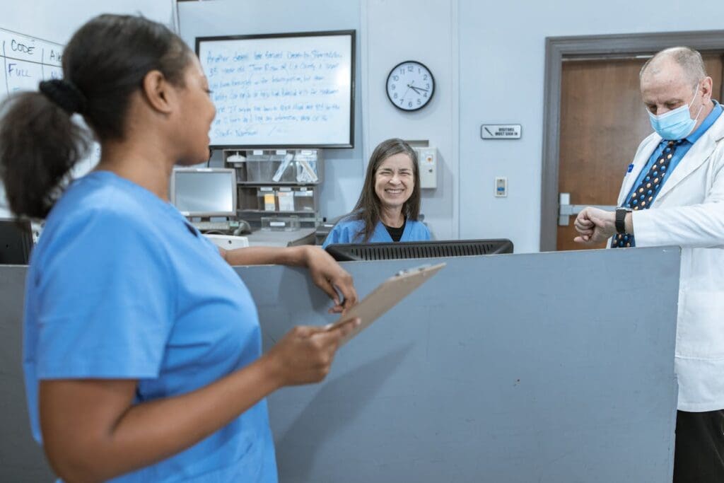 healthcare professionals smiling at each other